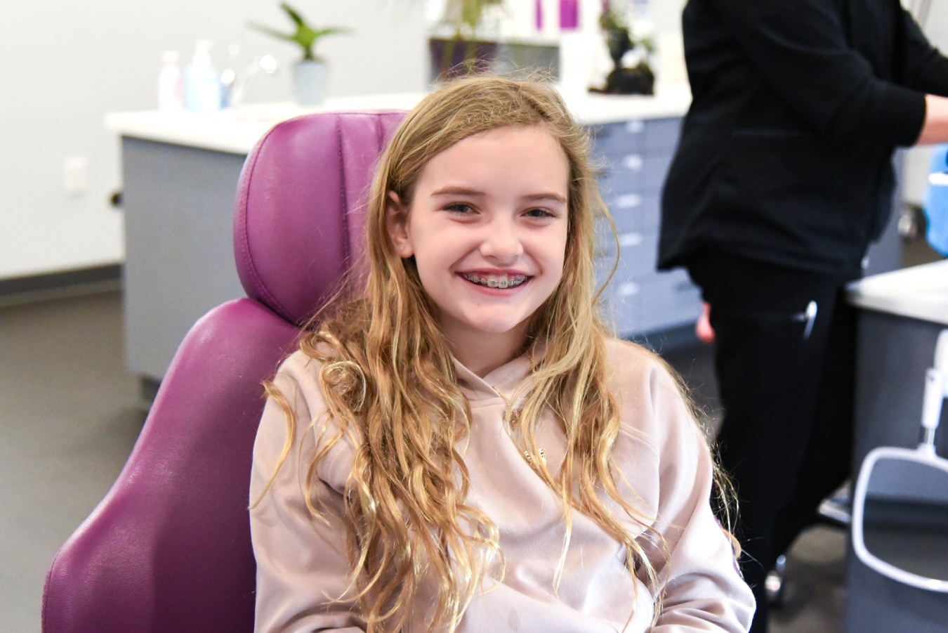 Young girl smiling with braces during her appointment at Purple Orthodontics in Granite Bay CA